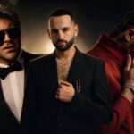 ثلاثة فنانين يرتدون نظارات شمسية ويقفون بجانب بعضهم