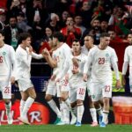 لاعب مغربي يحتفل بهدف في مباراة كرة قدم.